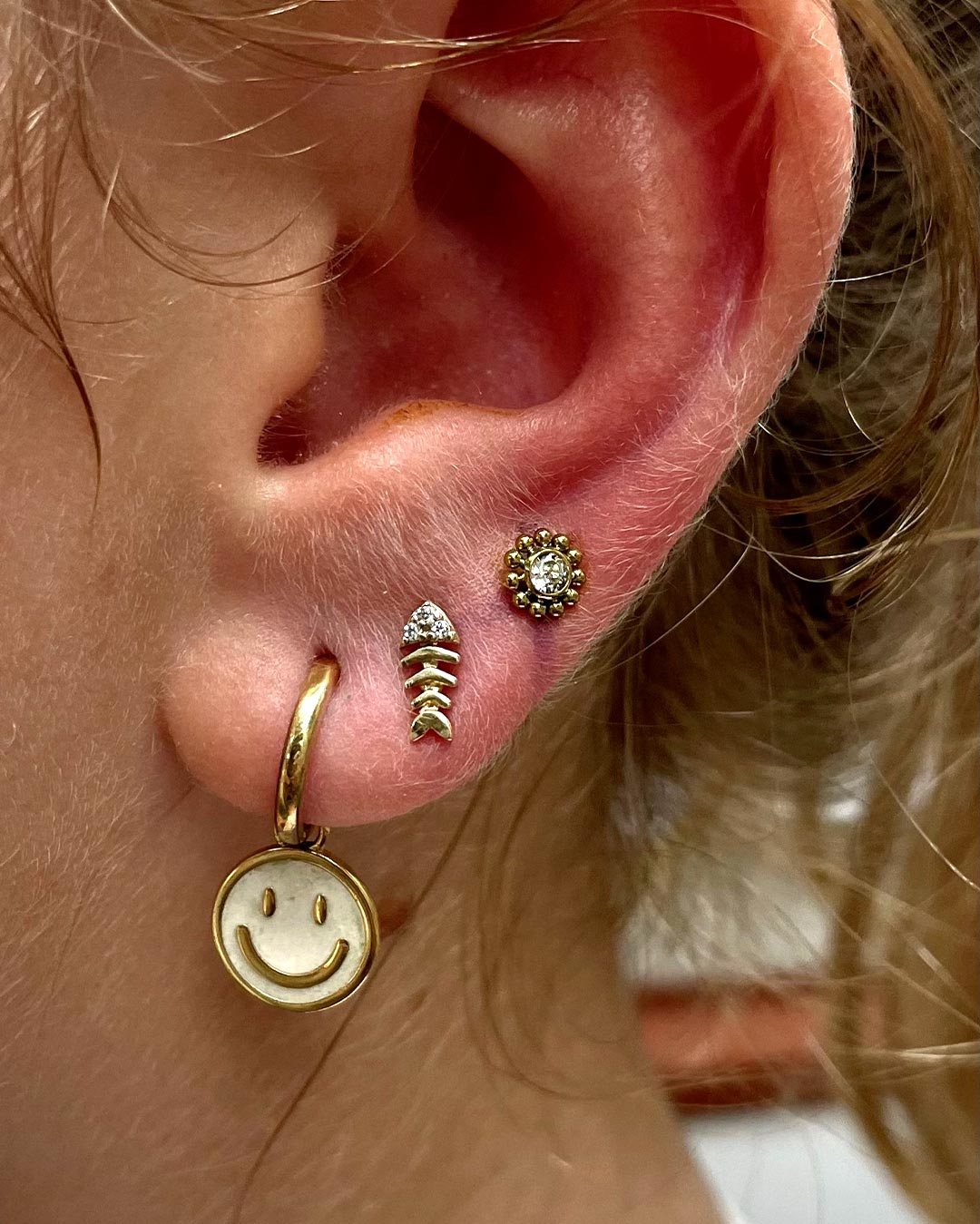 Compo piercings oreja hechos por Iván